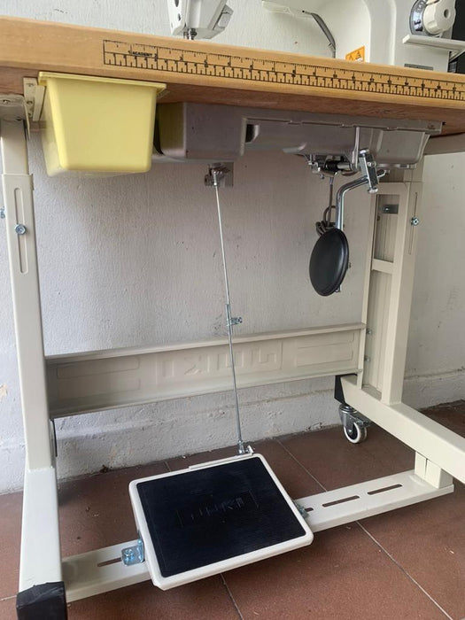 Single Needle Lockstitch, complete with Table, Stand with Direct Drive. Low cost, Value For Money sewing machine. The bottom view.