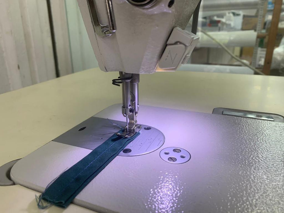 Single Needle Lockstitch, complete with Table, Stand with Direct Drive. Low cost, Value For Money sewing machine. Comfortable work space.
