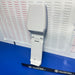 Needle detector device Model HN-30S 'HASHIMA Branded, stands upright on a blue surface in front of a white sheet covered with Sewing.sg text.